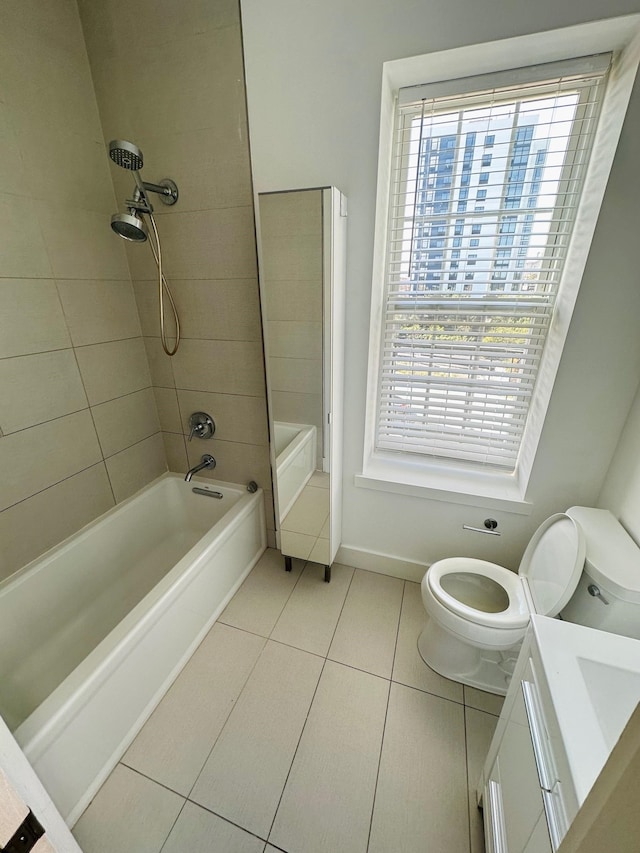 full bathroom with toilet, vanity, baseboards, shower / washtub combination, and tile patterned floors