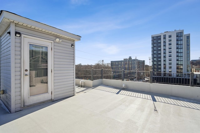 view of patio / terrace with an outdoor structure and a city view