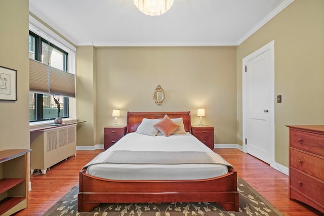 2600 Kennedy Blvd Unit 1H, Jersey City, NJ 07306 - bedroom featuring radiator heating unit, ornamental molding, and wood finished floors