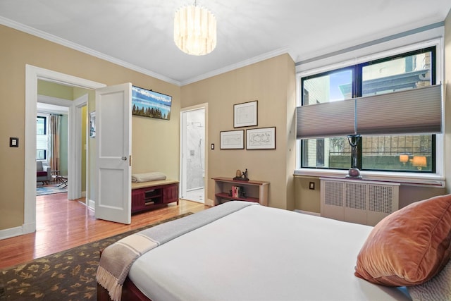 2600 Kennedy Blvd Unit 1H, Jersey City, NJ 07306 - bedroom with radiator heating unit, wood finished floors, crown molding, multiple windows, and connected bathroom