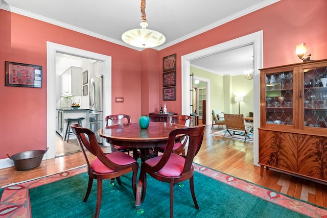 2600 Kennedy Blvd Unit 1H, Jersey City, NJ 07306 - dining space featuring hardwood / wood-style floors and ornamental molding