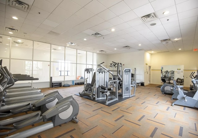 workout area featuring visible vents and carpet