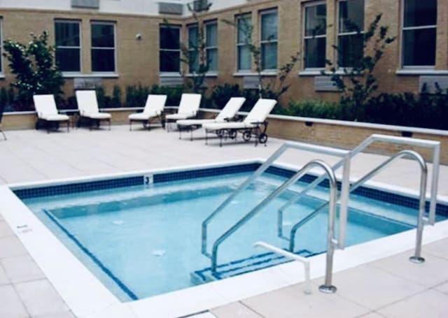 view of pool featuring a swimming pool and a patio area