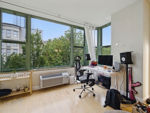 10 Regent St # 308, Jersey City, NJ 07302 - office area with an AC wall unit and hardwood / wood-style flooring