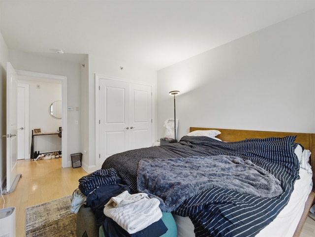 10 Regent St # 308, Jersey City, NJ 07302 - bedroom with wood finished floors and a closet