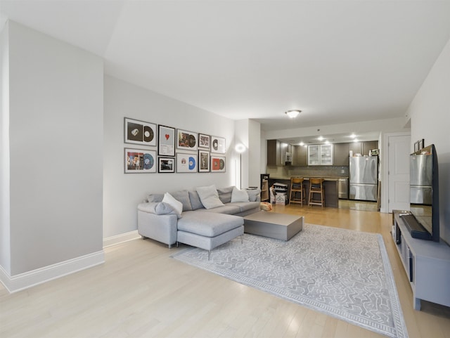 10 Regent St # 308, Jersey City, NJ 07302 - living area featuring light wood-style floors and baseboards