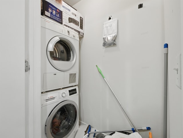 10 Regent St # 308, Jersey City, NJ 07302 - washroom featuring stacked washer / dryer