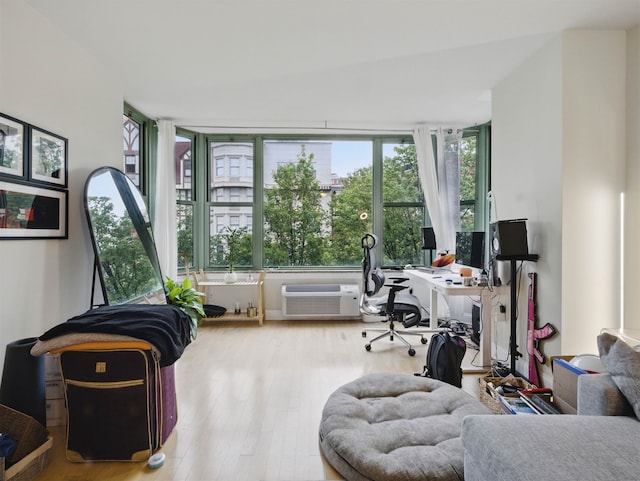 10 Regent St # 308, Jersey City, NJ 07302 - home office featuring a wall unit AC and wood finished floors