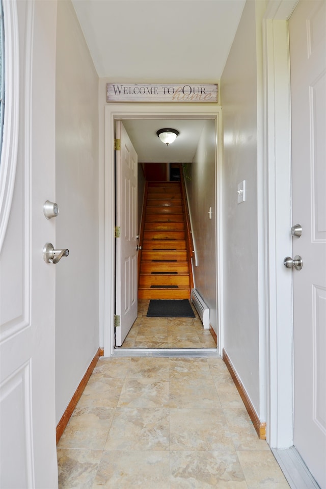 stairway with baseboard heating