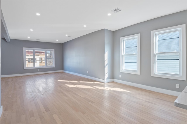 spare room featuring light hardwood / wood-style floors