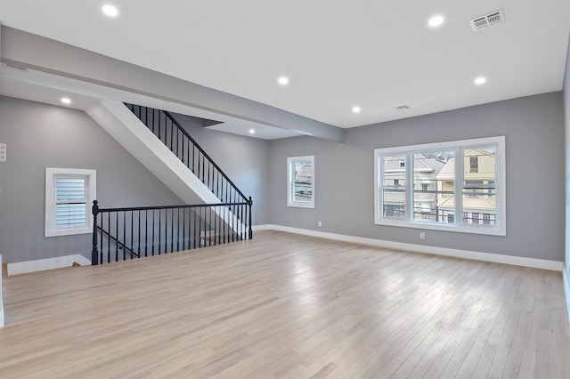 unfurnished living room with light wood-type flooring