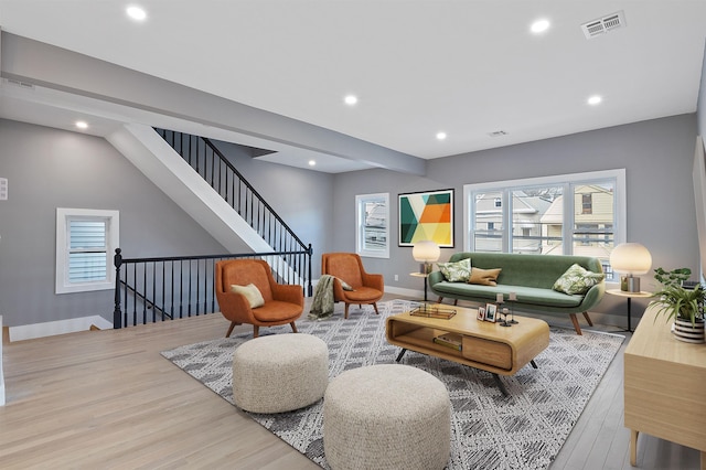 living room with light hardwood / wood-style flooring