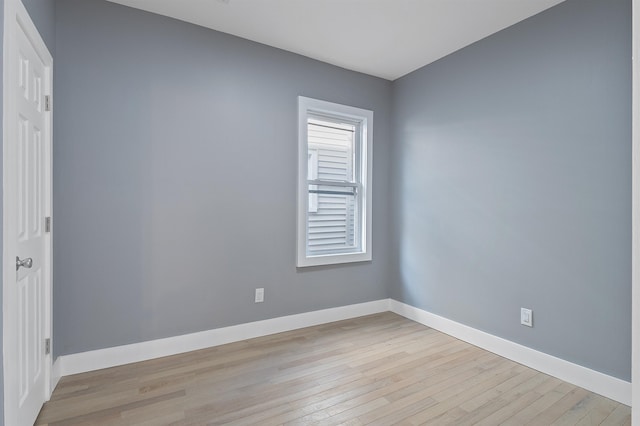 spare room with light hardwood / wood-style flooring