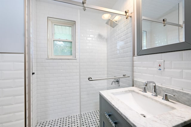 1 Congress St Unit 304, Jersey City, NJ 07307 - bathroom with a stall shower, vanity, and tile walls