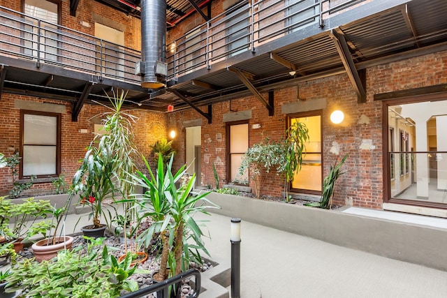 doorway to property featuring brick siding