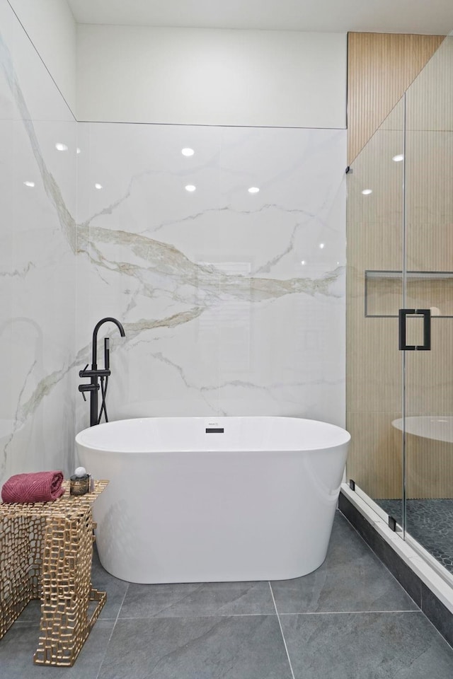 81 Webster Ave Unit 1, Jersey City, NJ 07307 - bathroom featuring tile walls, a stall shower, and a freestanding bath