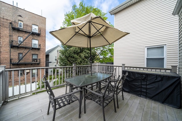 deck featuring outdoor dining area