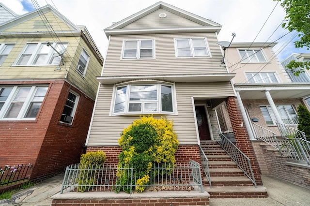 view of front of house featuring brick siding