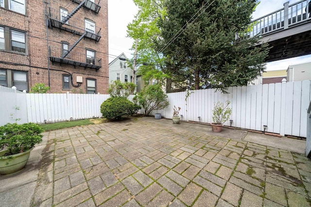view of patio / terrace featuring fence