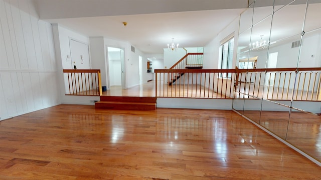 602 Sanderling Ct Unit 602, Secaucus, NJ 07094 - spare room with an inviting chandelier, visible vents, and wood finished floors