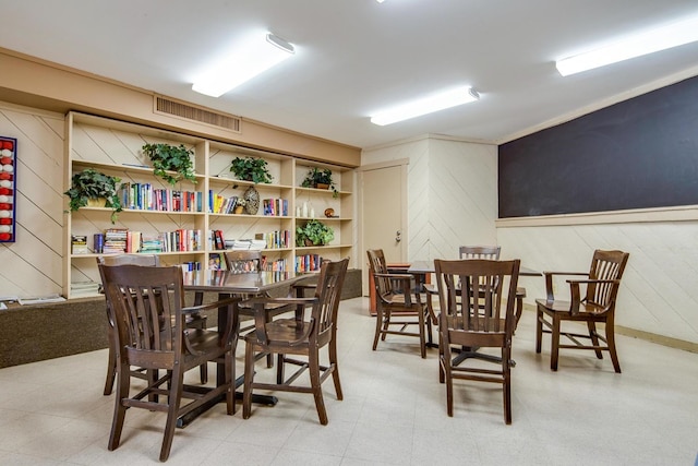 602 Sanderling Ct Unit 602, Secaucus, NJ 07094 - dining space with tile patterned floors, visible vents, and wooden walls