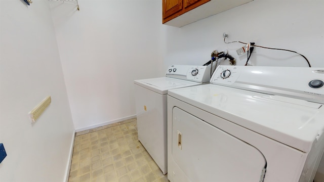 602 Sanderling Ct Unit 602, Secaucus, NJ 07094 - laundry area featuring washing machine and dryer, light floors, cabinet space, and baseboards