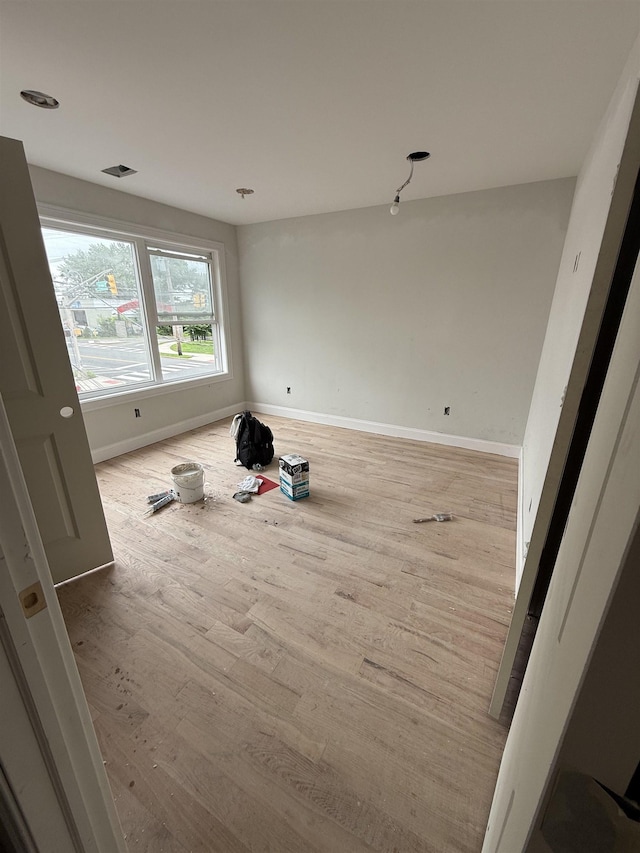 228 Oakwood Ave, Kearny, NJ 07032 - empty room with baseboards and wood finished floors