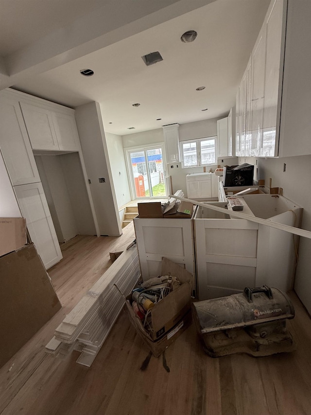 228 Oakwood Ave, Kearny, NJ 07032 - kitchen with light wood finished floors, white cabinets, a peninsula, and recessed lighting