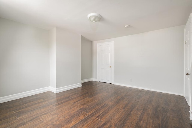 69 Belmont Ave, Jersey City, NJ 07304 - unfurnished room featuring dark wood finished floors, baseboards, and a smoke detector