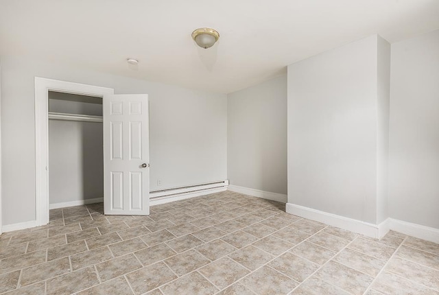 69 Belmont Ave, Jersey City, NJ 07304 - unfurnished bedroom featuring a baseboard heating unit, a closet, and baseboards