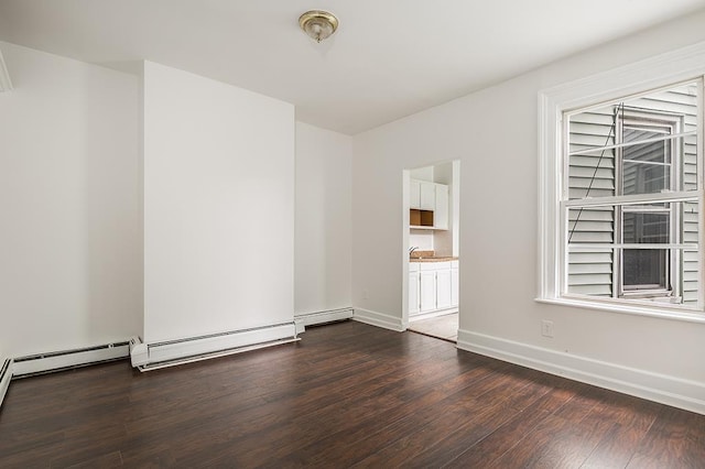 69 Belmont Ave, Jersey City, NJ 07304 - empty room with dark wood-style floors and baseboards