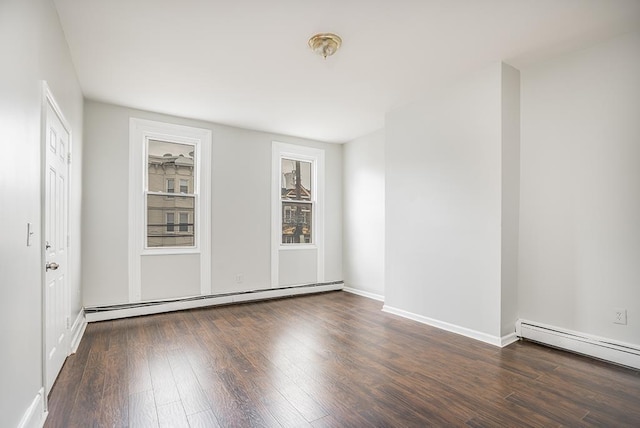 69 Belmont Ave, Jersey City, NJ 07304 - empty room featuring baseboard heating, wood finished floors, and baseboards