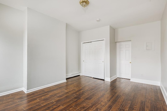69 Belmont Ave, Jersey City, NJ 07304 - unfurnished bedroom with dark wood-style flooring, a baseboard radiator, baseboards, and a closet