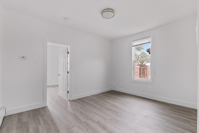 51 Lord Ave, Bayonne, NJ 07002 - spare room featuring light wood finished floors, a smoke detector, and baseboard heating