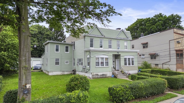 51 Lord Ave, Bayonne, NJ 07002 - view of front facade featuring a front lawn