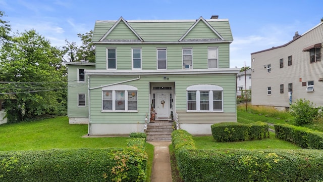 51 Lord Ave, Bayonne, NJ 07002 - view of property featuring a front yard and a chimney