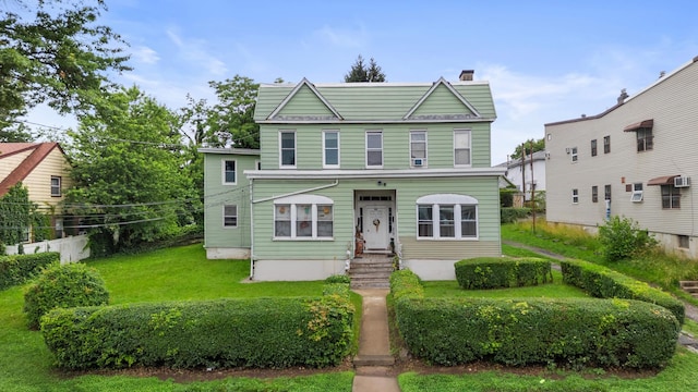 51 Lord Ave, Bayonne, NJ 07002 - view of front facade featuring a chimney and a front yard