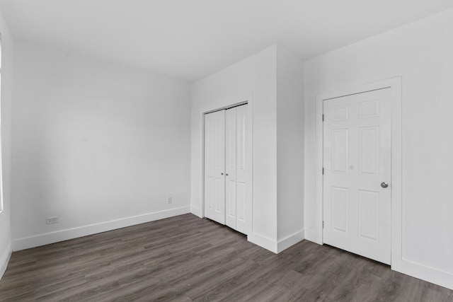51 Lord Ave, Bayonne, NJ 07002 - unfurnished bedroom with dark wood-style floors and a closet