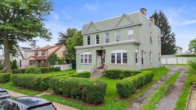 51 Lord Ave, Bayonne, NJ 07002 - townhome / multi-family property featuring a chimney and an outbuilding