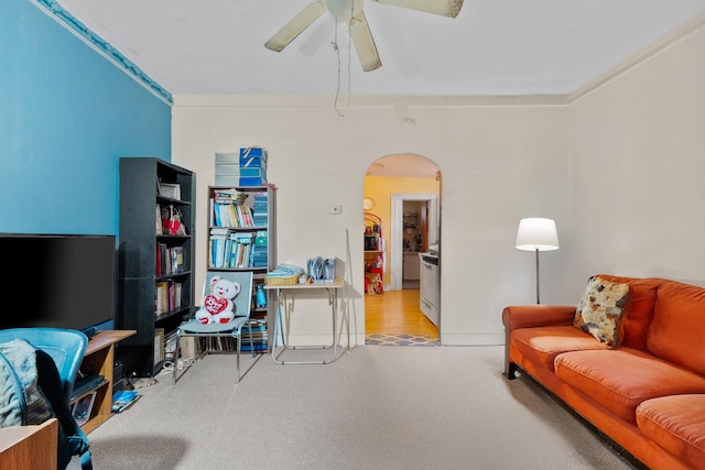 51 Lord Ave, Bayonne, NJ 07002 - living room featuring arched walkways, ceiling fan, and carpet flooring