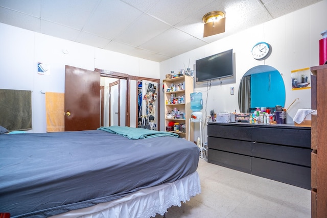 bedroom with a paneled ceiling