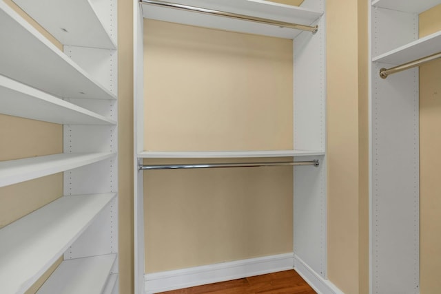 walk in closet featuring hardwood / wood-style floors