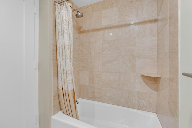 bathroom with shower / tub combo