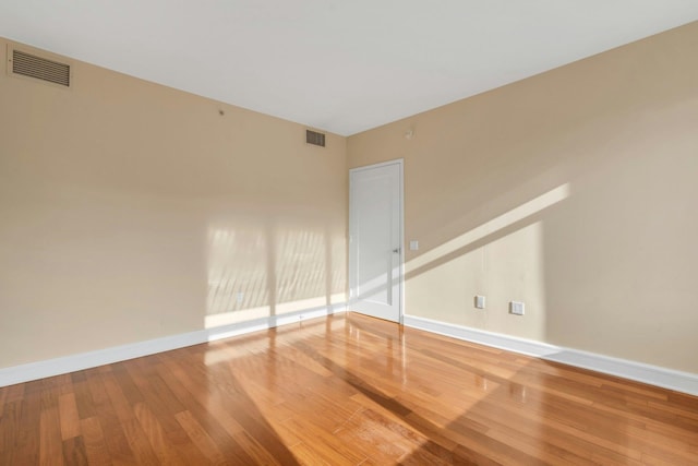 empty room featuring hardwood / wood-style flooring