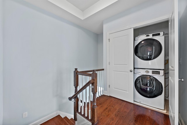 129 Roosevelt Dr, Wood-Ridge, NJ 07075 - washroom featuring estacked washer and dryer, wood finished floors, and baseboards
