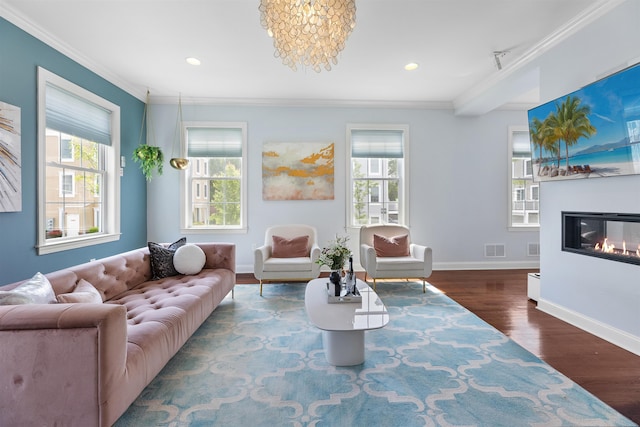 129 Roosevelt Dr, Wood-Ridge, NJ 07075 - living area featuring ornamental molding, healthy amount of natural light, baseboards, wood finished floors, and a glass covered fireplace