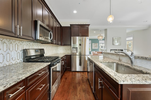 129 Roosevelt Dr, Wood-Ridge, NJ 07075 - kitchen with appliances with stainless steel finishes, a sink, crown molding, dark wood-style flooring, and light stone counters