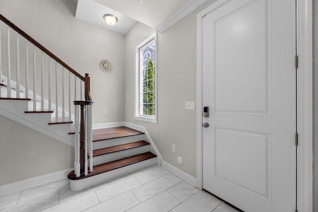 129 Roosevelt Dr, Wood-Ridge, NJ 07075 - entryway featuring stairs, marble look tiles, and baseboards