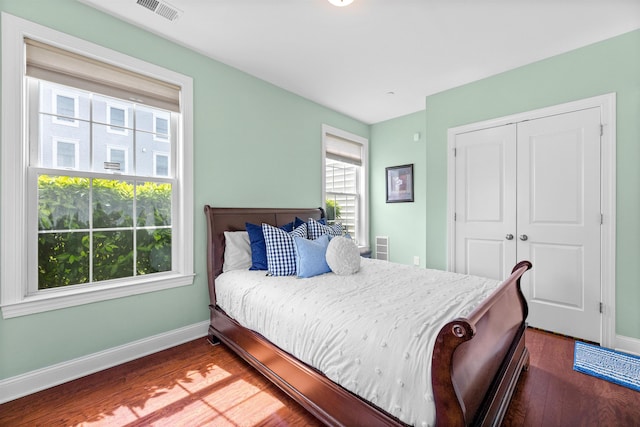129 Roosevelt Dr, Wood-Ridge, NJ 07075 - bedroom featuring baseboards, dark wood-style floors, and a closet