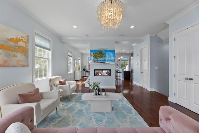 129 Roosevelt Dr, Wood-Ridge, NJ 07075 - living area featuring a chandelier, wood finished floors, a glass covered fireplace, healthy amount of natural light, and crown molding